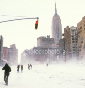 istockphoto_1439793-people-walking-streets-during-new-york-city-snow-storm